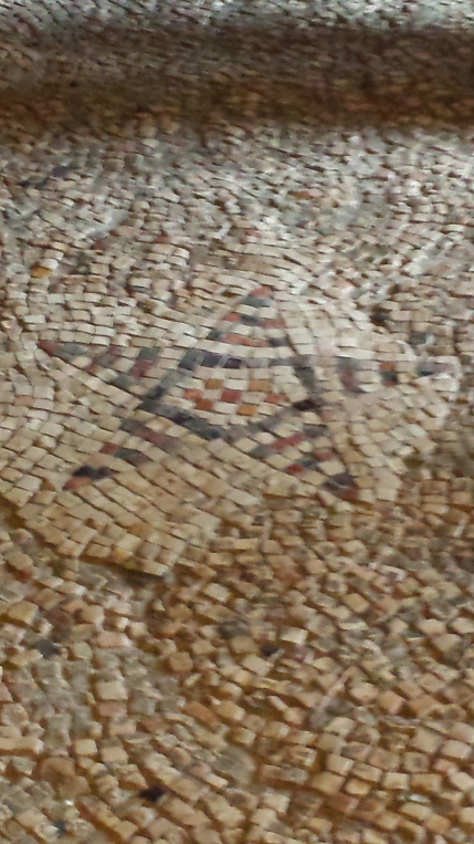 A Byzantine mosaic in the floor of the church - the star seen by the shepherds.