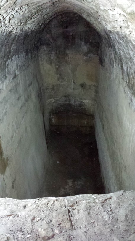 Looking into the remains of a cistern associated with the pools