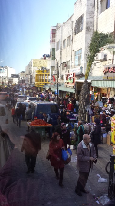 Bus vs. Busy market street in Ramallah